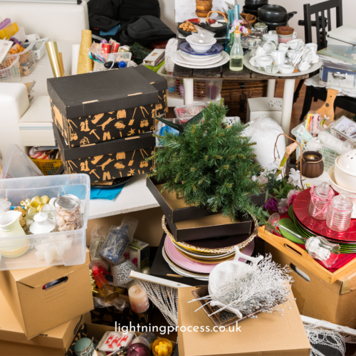 cluttered room with piles of things